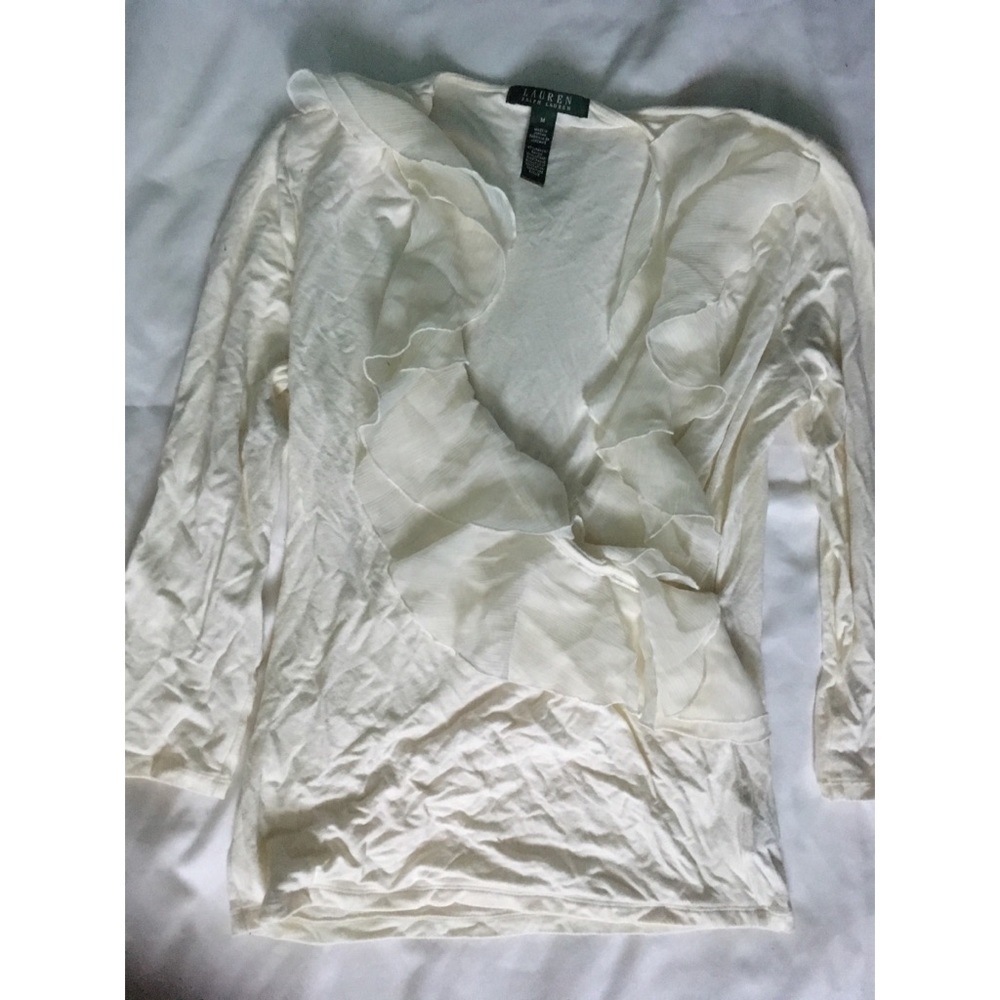 Cream colored long sleeve blouse